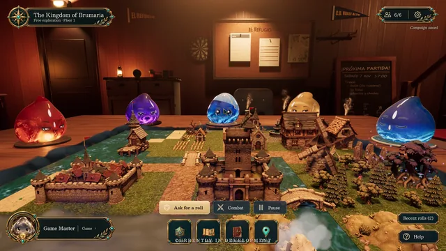 Los slimes alrededor del reino en miniatura, con su castillo, molino y bosque.